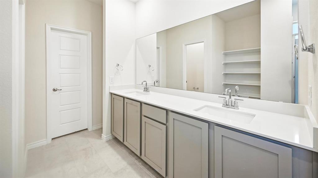 2317 Chloe Lane Anna, TX 75409 - Photo 1 of 1 a bathroom with a sink and a mirror