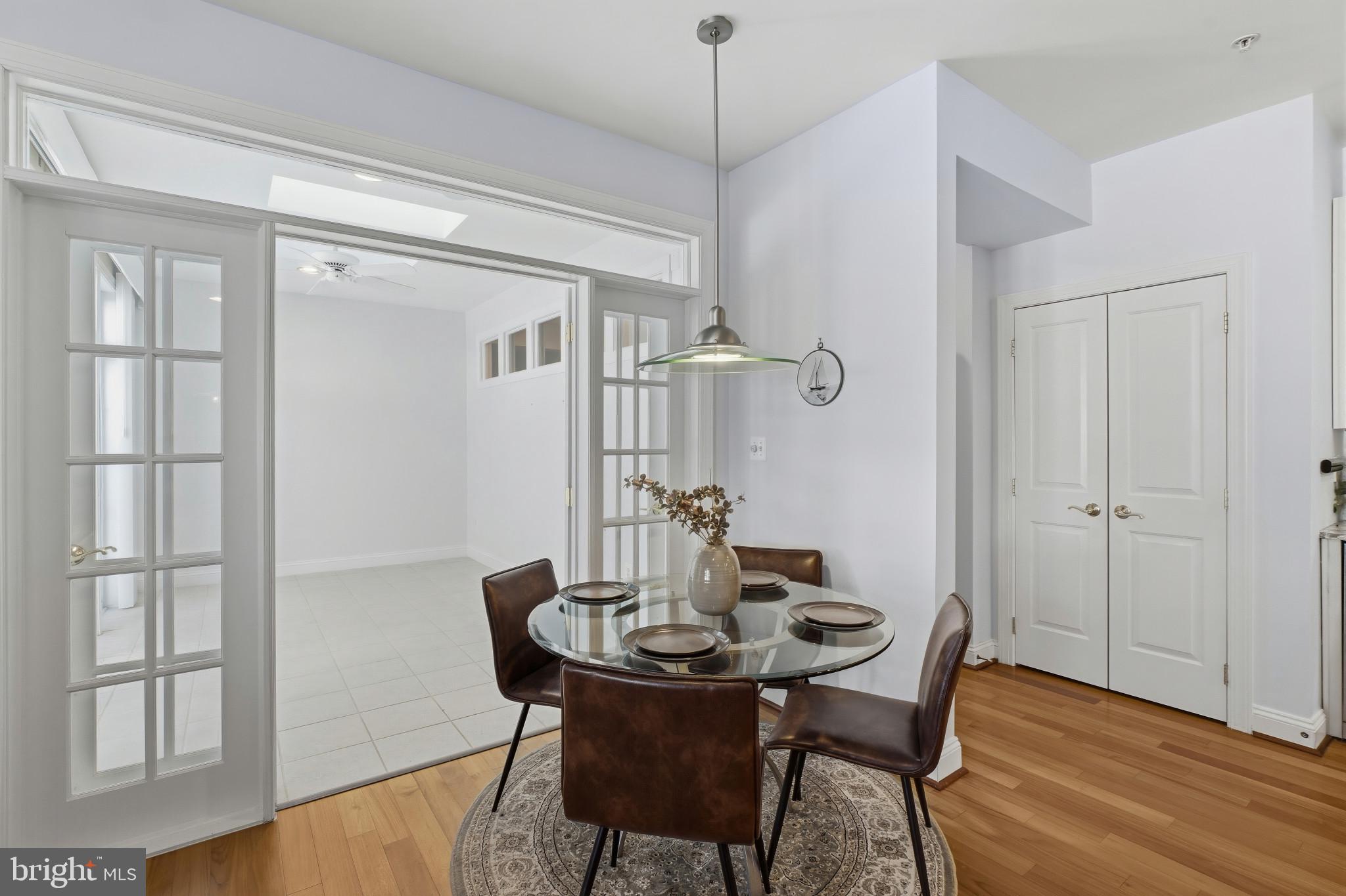 2607 Buckingham Road, Unit 78 Ellicott City, MD 21043 - Photo 11 of 43 a view of a dining room with furniture window and wooden floor