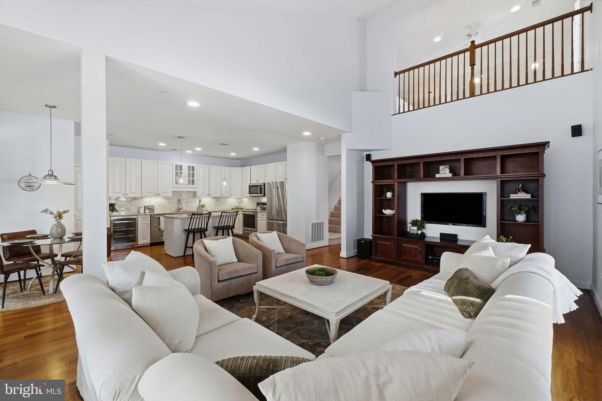 2607 Buckingham Road, Unit 78 Ellicott City, MD 21043 - Photo 13 of 43 a living room with furniture and a fireplace