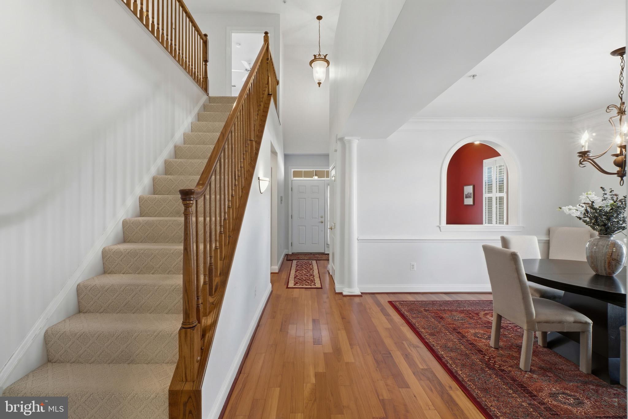 2607 Buckingham Road, Unit 78 Ellicott City, MD 21043 - Photo 23 of 43 a view of a hallway with furniture and wooden floor