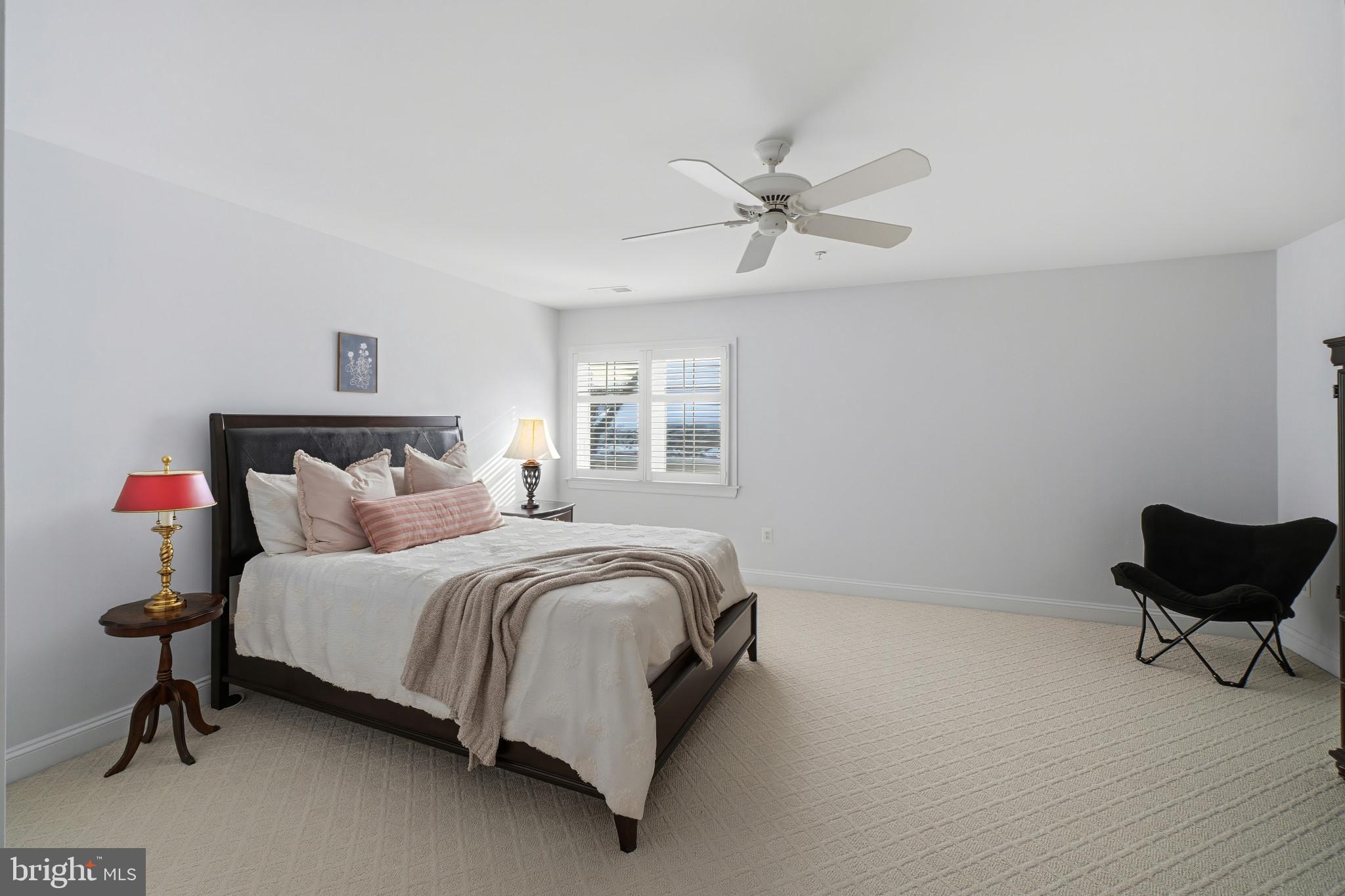 2607 Buckingham Road, Unit 78 Ellicott City, MD 21043 - Photo 32 of 43 a bedroom with a bed and a chair