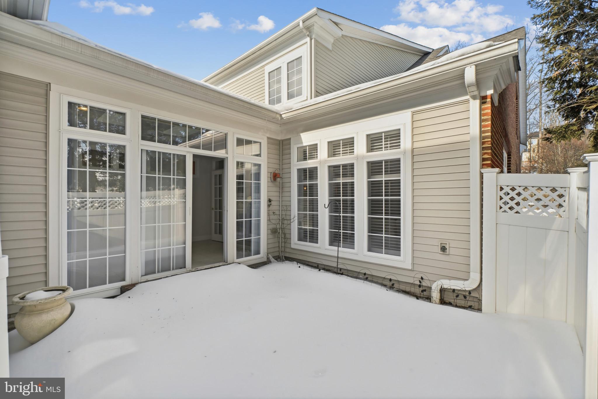 2607 Buckingham Road, Unit 78 Ellicott City, MD 21043 - Photo 35 of 43 a view of a house with a large window and wooden fence