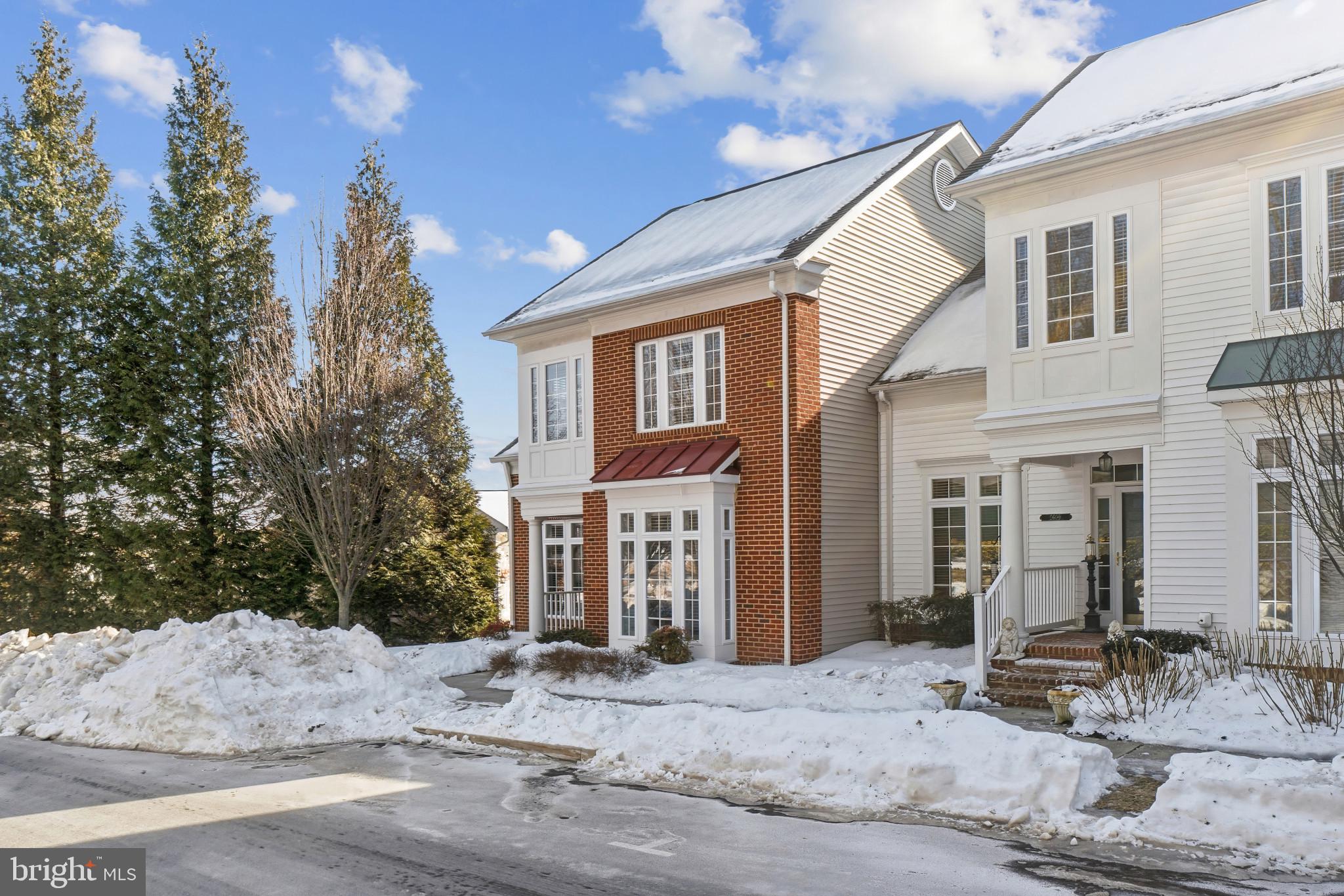 2607 Buckingham Road, Unit 78 Ellicott City, MD 21043 - Photo 40 of 43 a front view of a house with a yard