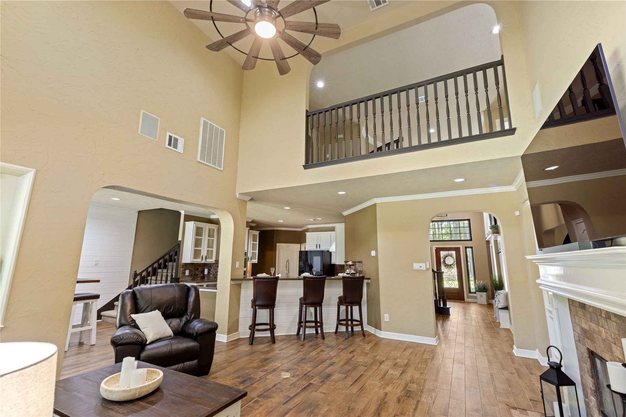 13322 Stonecrest Lane Conroe, TX 77302 - Photo 12 of 50 a living room with furniture and a wooden floor