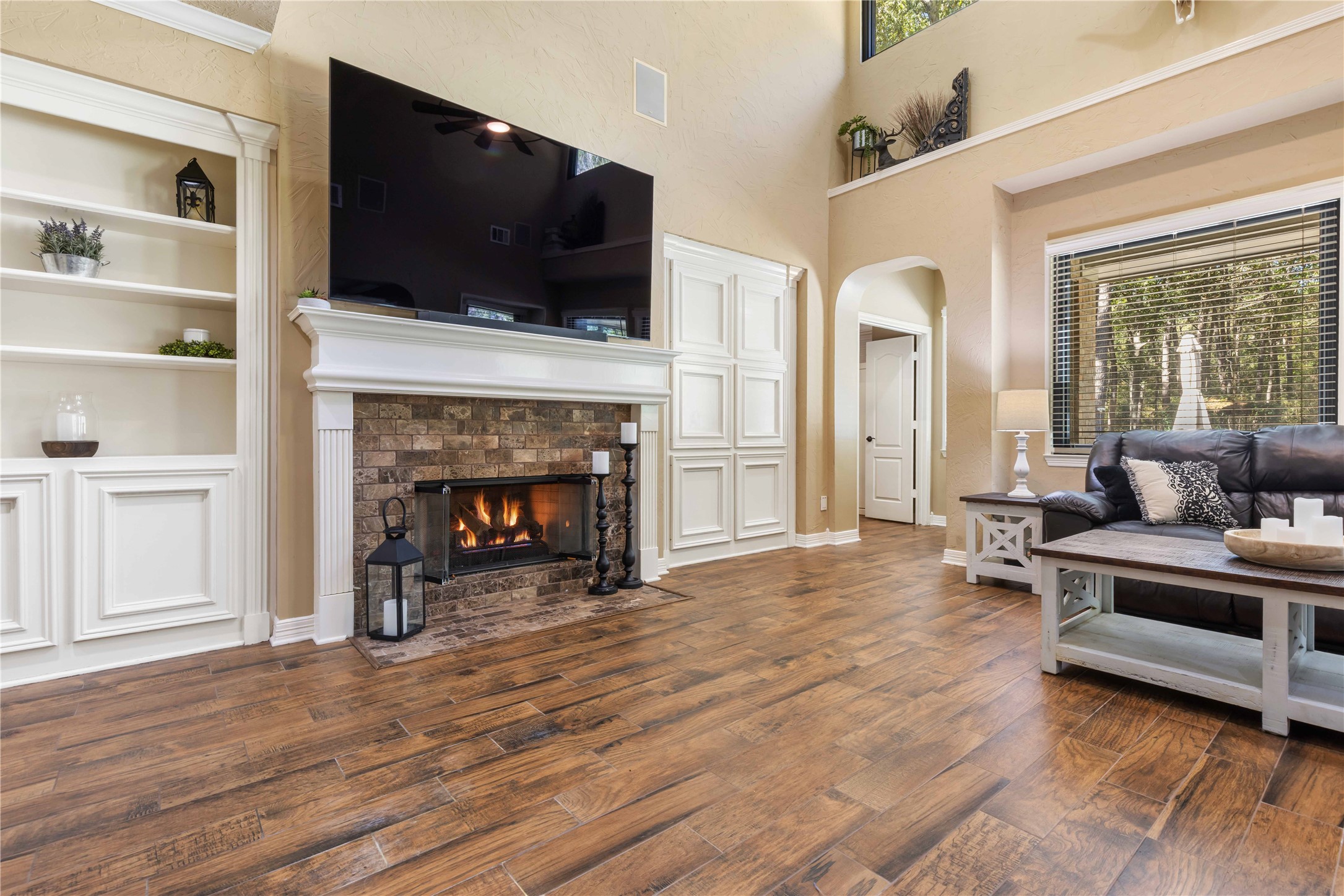 13322 Stonecrest Lane Conroe, TX 77302 - Photo 13 of 50 a living room with furniture and a fireplace