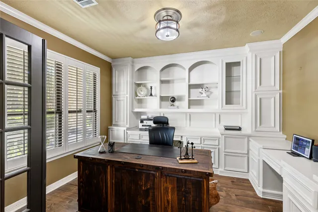 a kitchen with a sink cabinets and window