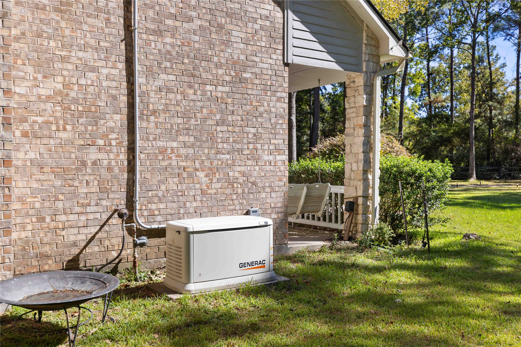 13322 Stonecrest Lane Conroe, TX 77302 - Photo 40 of 50 a view of a chair and table in backyard of the house