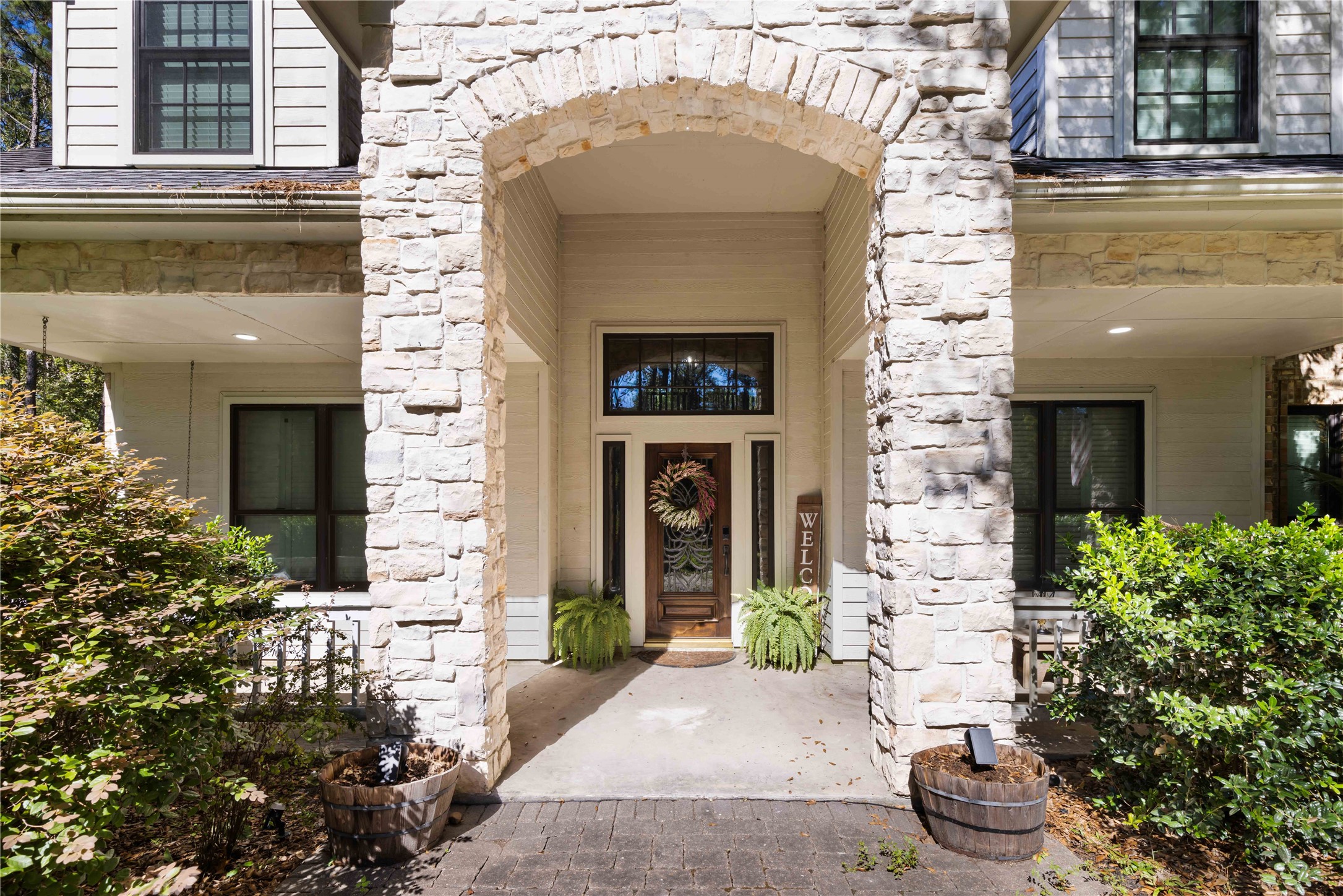13322 Stonecrest Lane Conroe, TX 77302 - Photo 4 of 50 a front view of a house with a yard