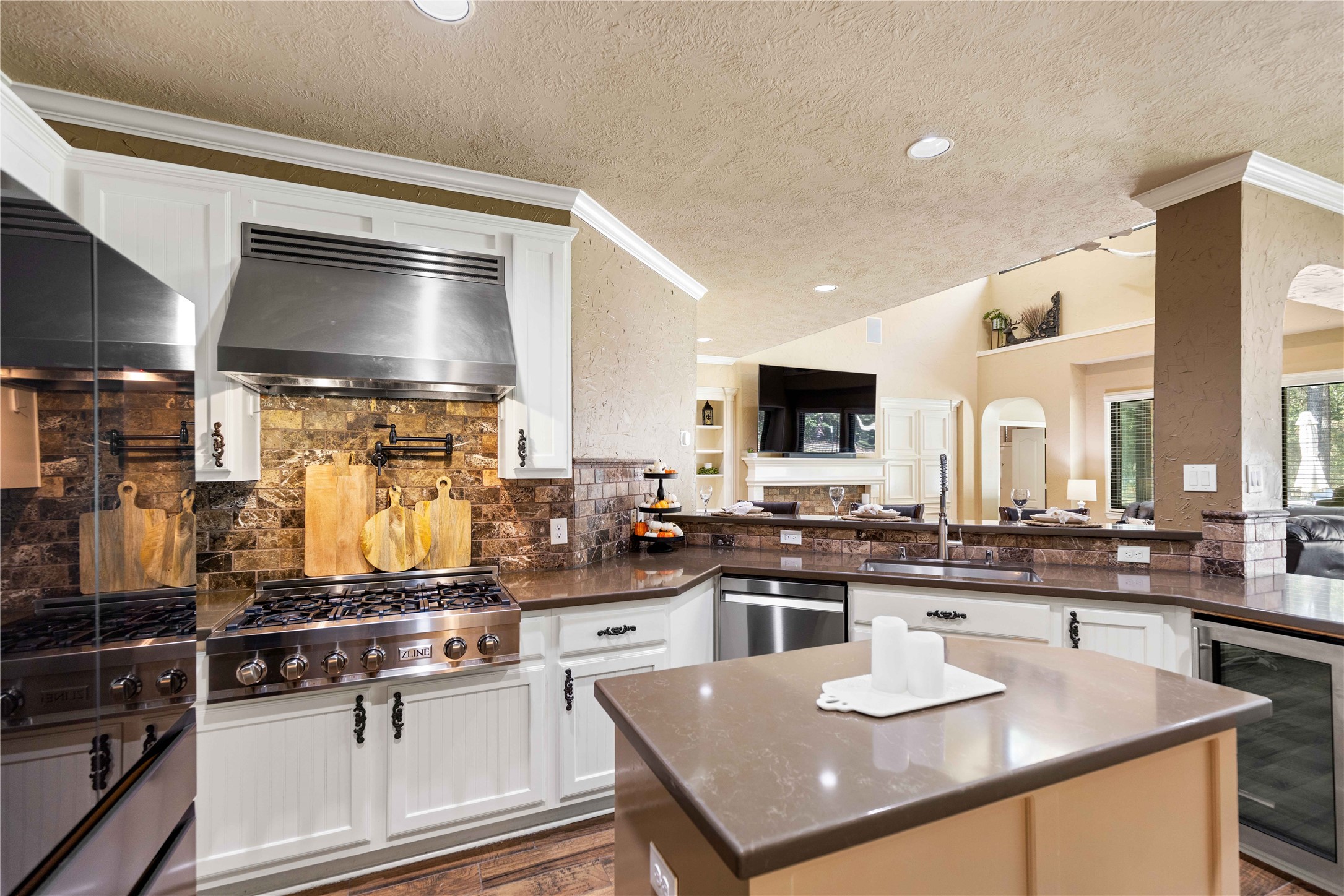 13322 Stonecrest Lane Conroe, TX 77302 - Photo 7 of 50 a kitchen with stainless steel appliances granite countertop a sink a stove and a refrigerator