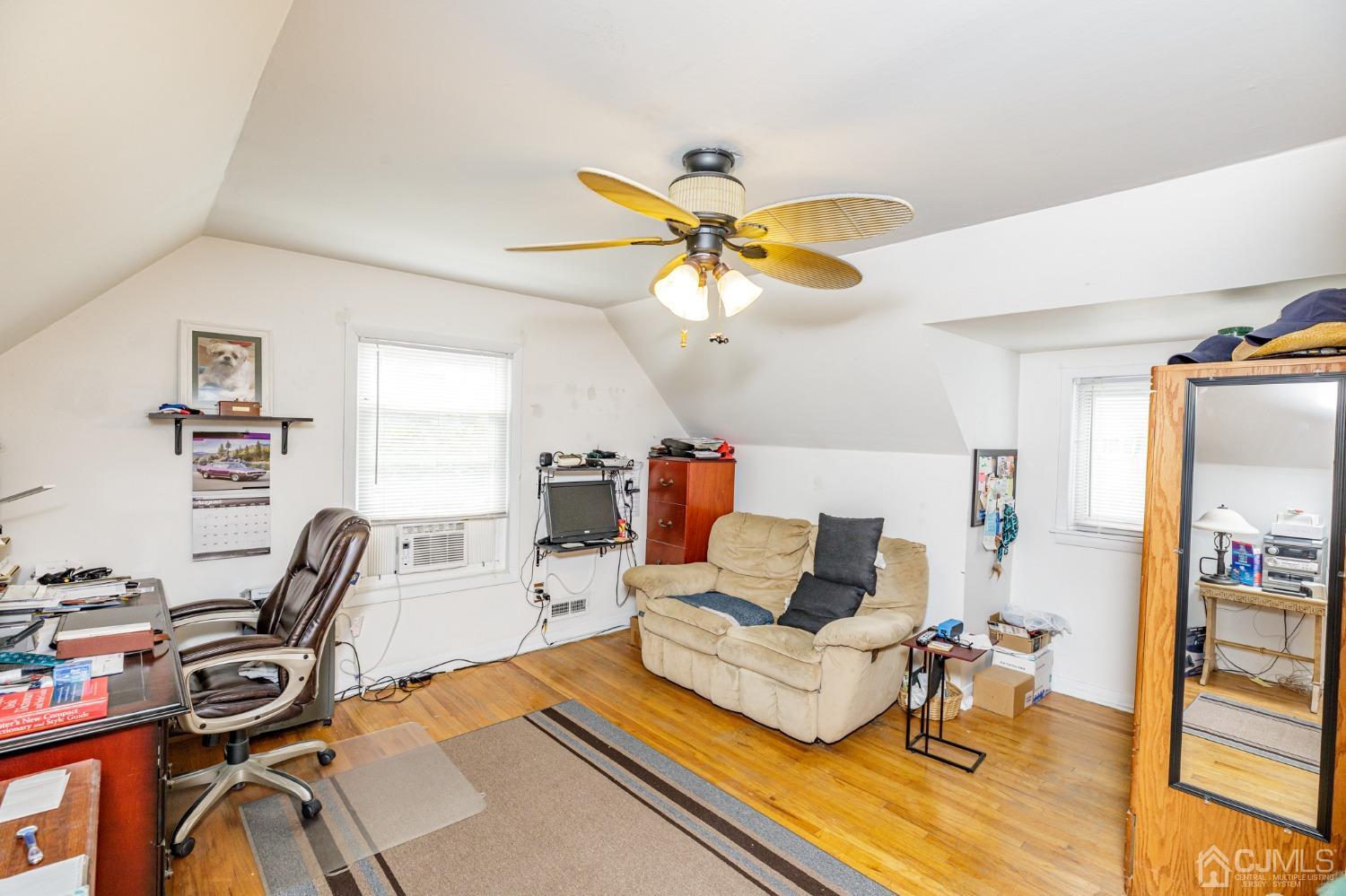 2761 Hickory Road Union, NJ 07083 - Photo 17 of 30 a living room with furniture a rug and a flat screen tv