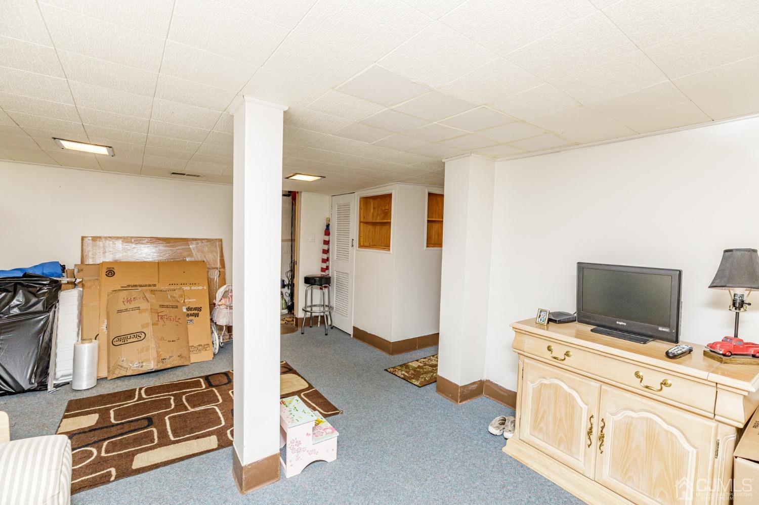 2761 Hickory Road Union, NJ 07083 - Photo 23 of 30 a view of a livingroom with furniture and a flat screen tv