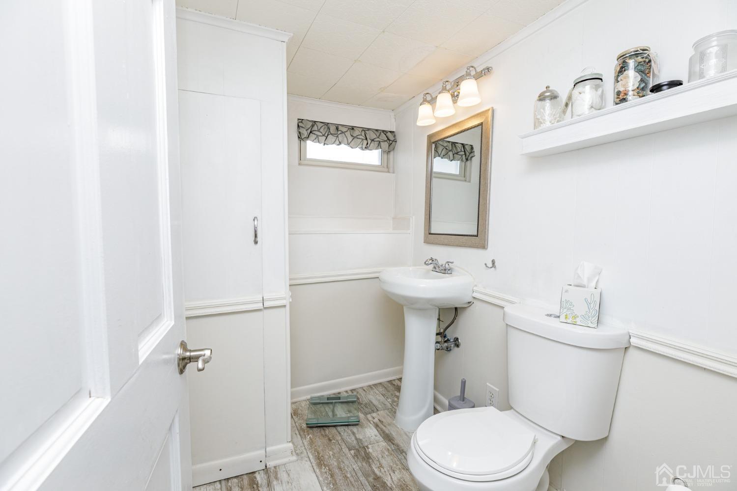 2761 Hickory Road Union, NJ 07083 - Photo 24 of 30 a white toilet sitting next to a bathroom sink