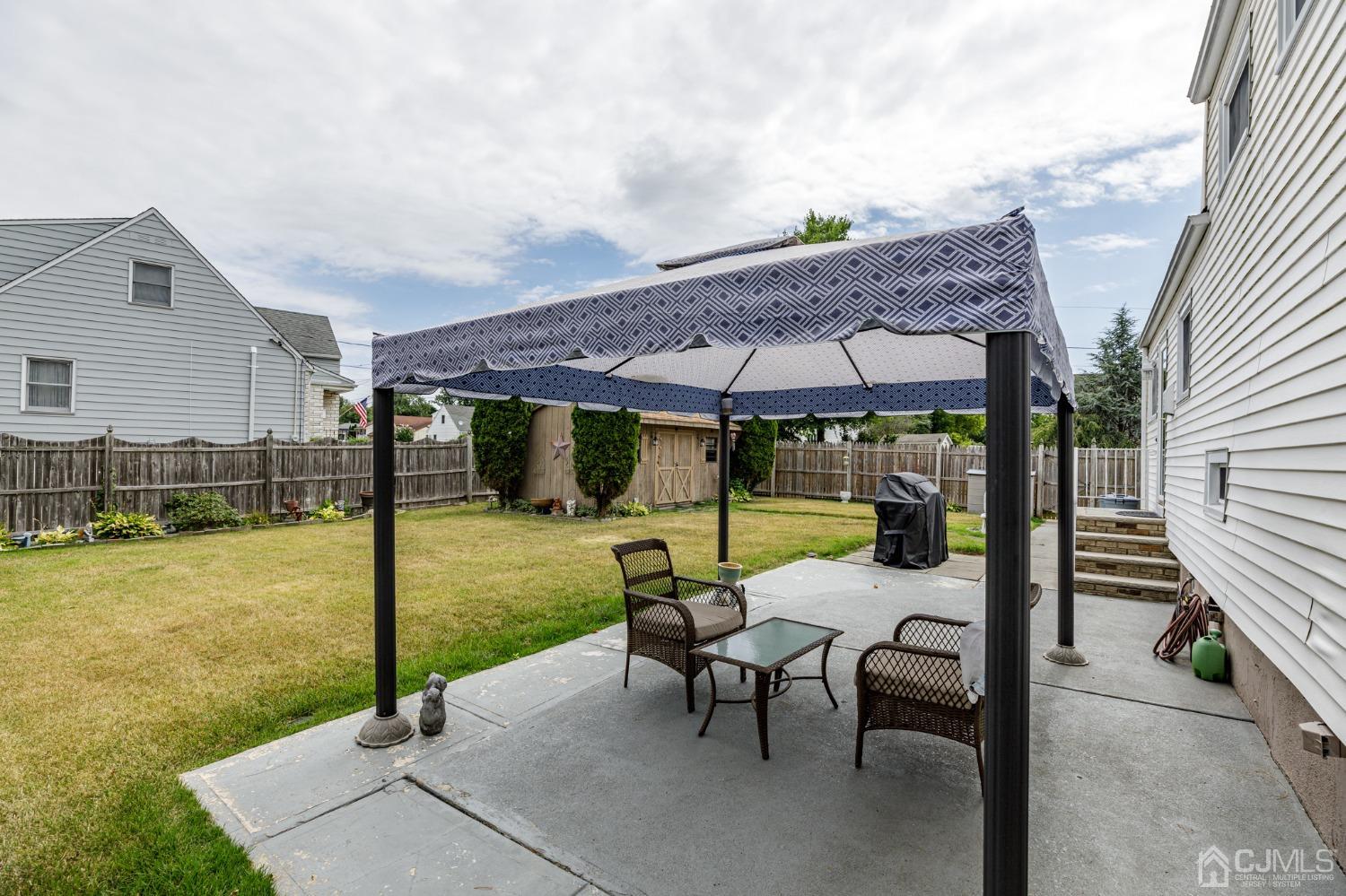 2761 Hickory Road Union, NJ 07083 - Photo 26 of 30 a view of a patio with a table chairs and a backyard