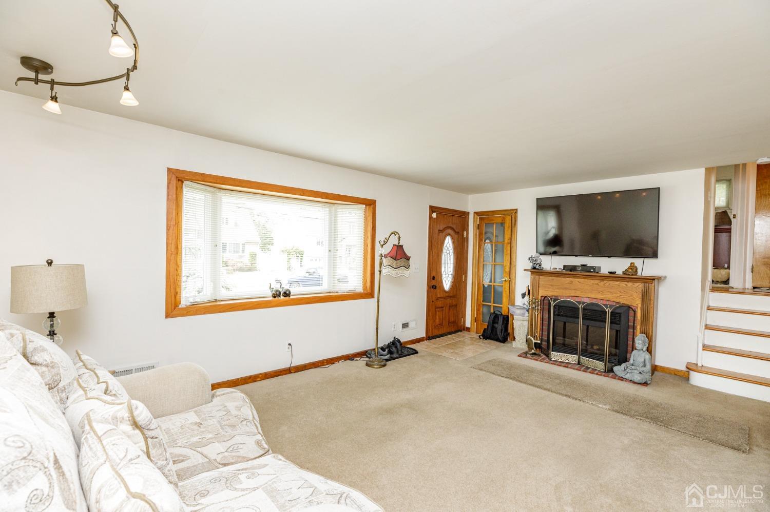 2761 Hickory Road Union, NJ 07083 - Photo 4 of 30 a view of a bedroom with furniture and a flat screen tv