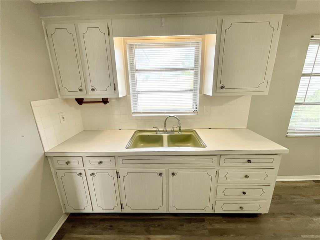 1541 Alert Street Holiday, FL 34690 - Photo 5 of 17 a utility room with cabinets washer and dryer