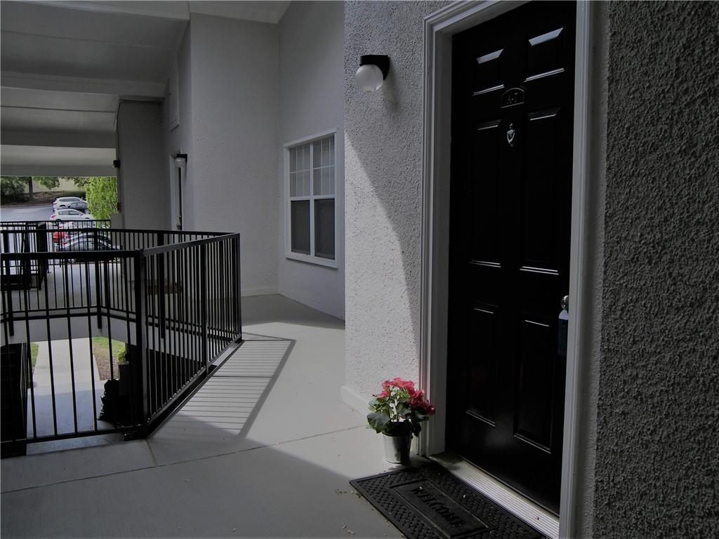 a view of entryway and hall with a potted plant