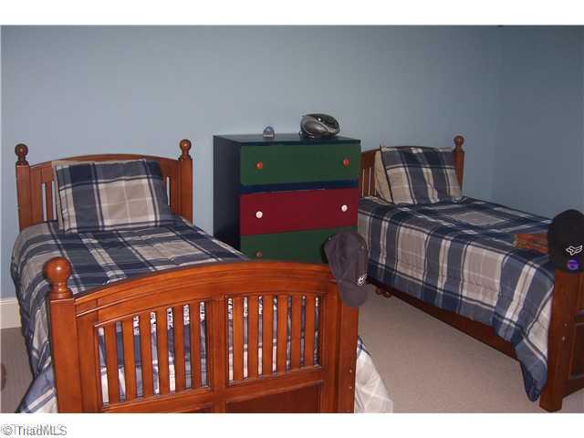7774 Sutter Road Greensboro, NC 27455 - Photo 14 of 16 2nd Bedroom. Three large bedroom and 2 full baths on second level.