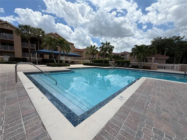 a view of a swimming pool with a patio