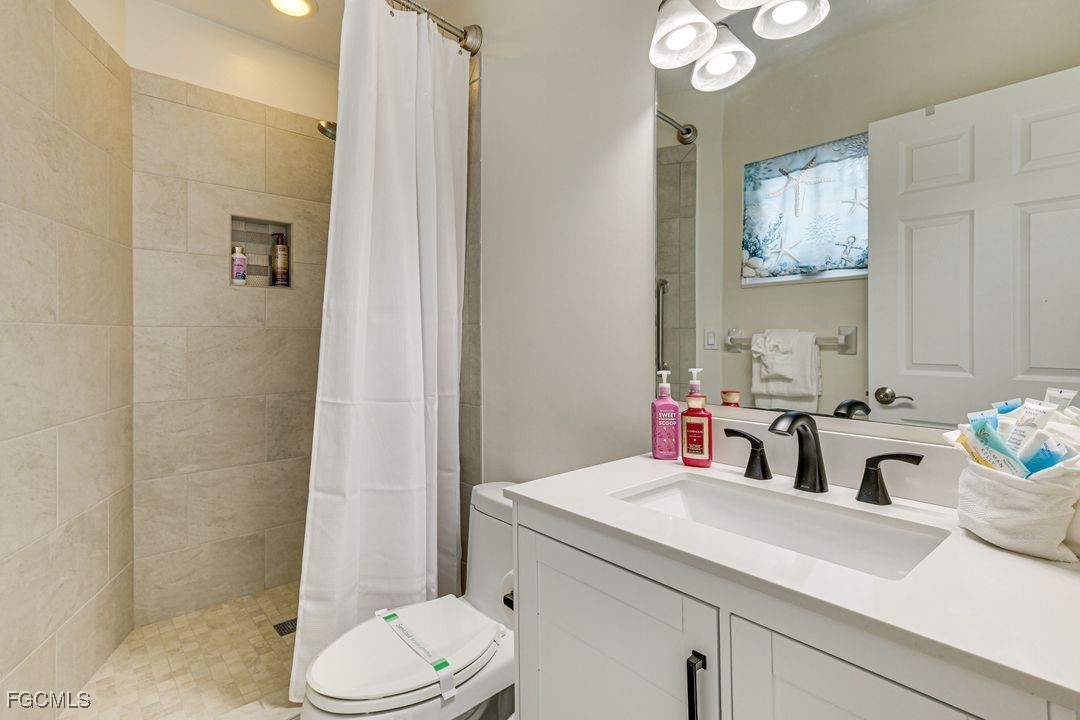 15340 River By Road Fort Myers, FL 33908 - Photo 15 of 21 a bathroom with a sink toilet and shower