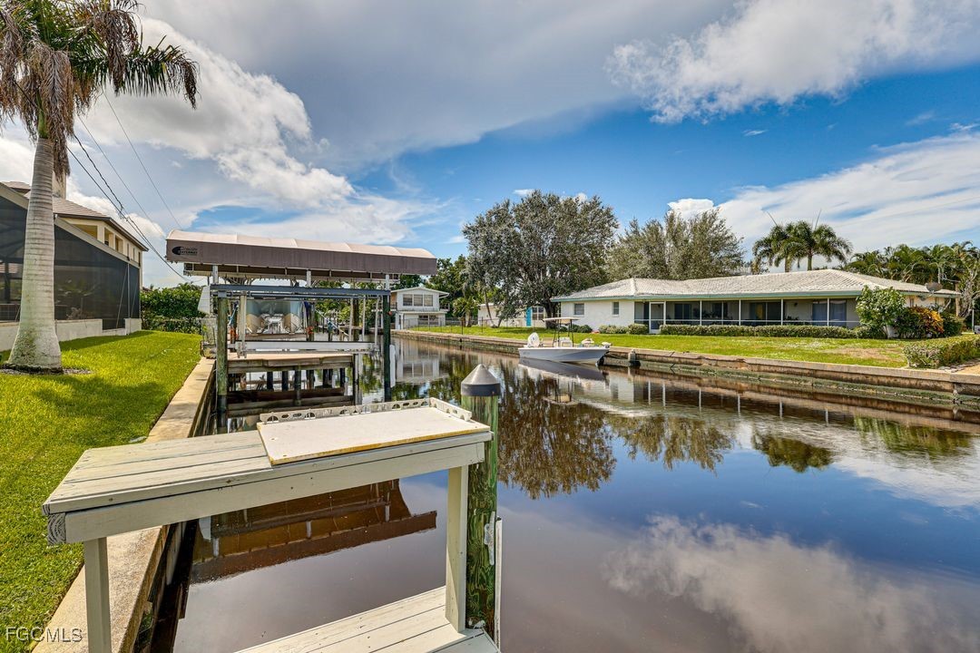 15340 River By Road Fort Myers, FL 33908 - Photo 18 of 21 a view of a lake with a house swimming pool and outdoor space