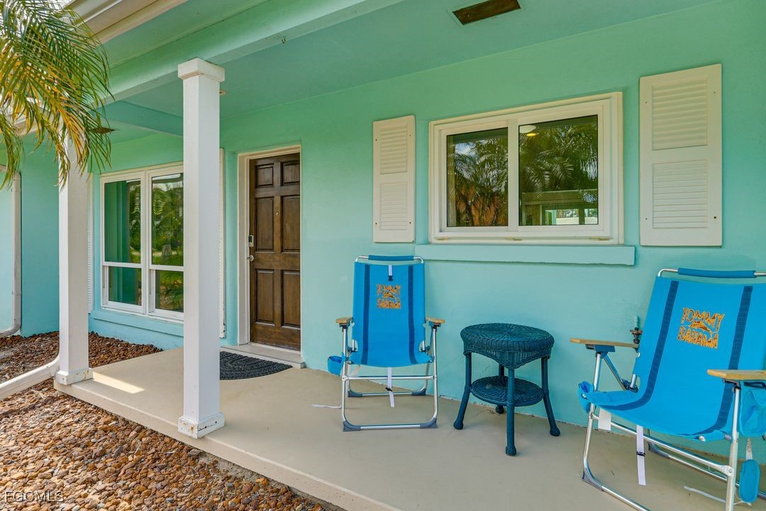 15340 River By Road Fort Myers, FL 33908 - Photo 19 of 21 a front view of a house with outdoor seating