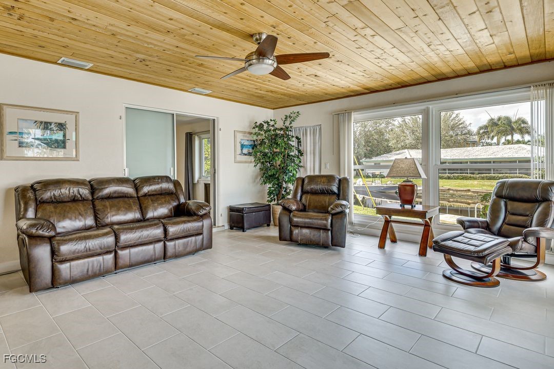 15340 River By Road Fort Myers, FL 33908 - Photo 7 of 21 a living room with furniture and a flat screen tv