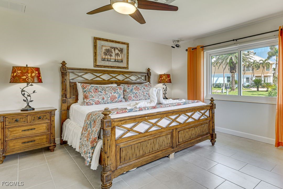 15340 River By Road Fort Myers, FL 33908 - Photo 8 of 21 a bed sitting in a bedroom next to a window