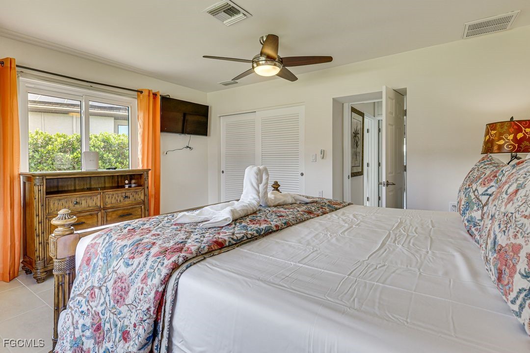 15340 River By Road Fort Myers, FL 33908 - Photo 9 of 21 a bedroom with a large bed and a window