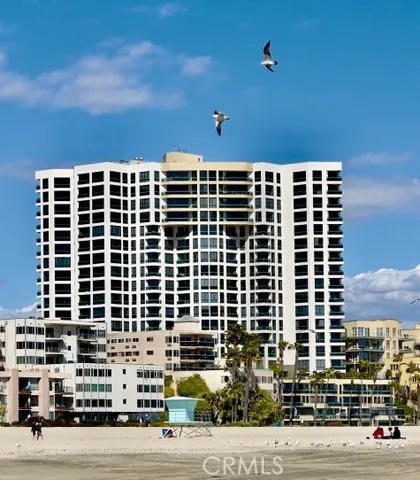 a front view of a building with a yard
