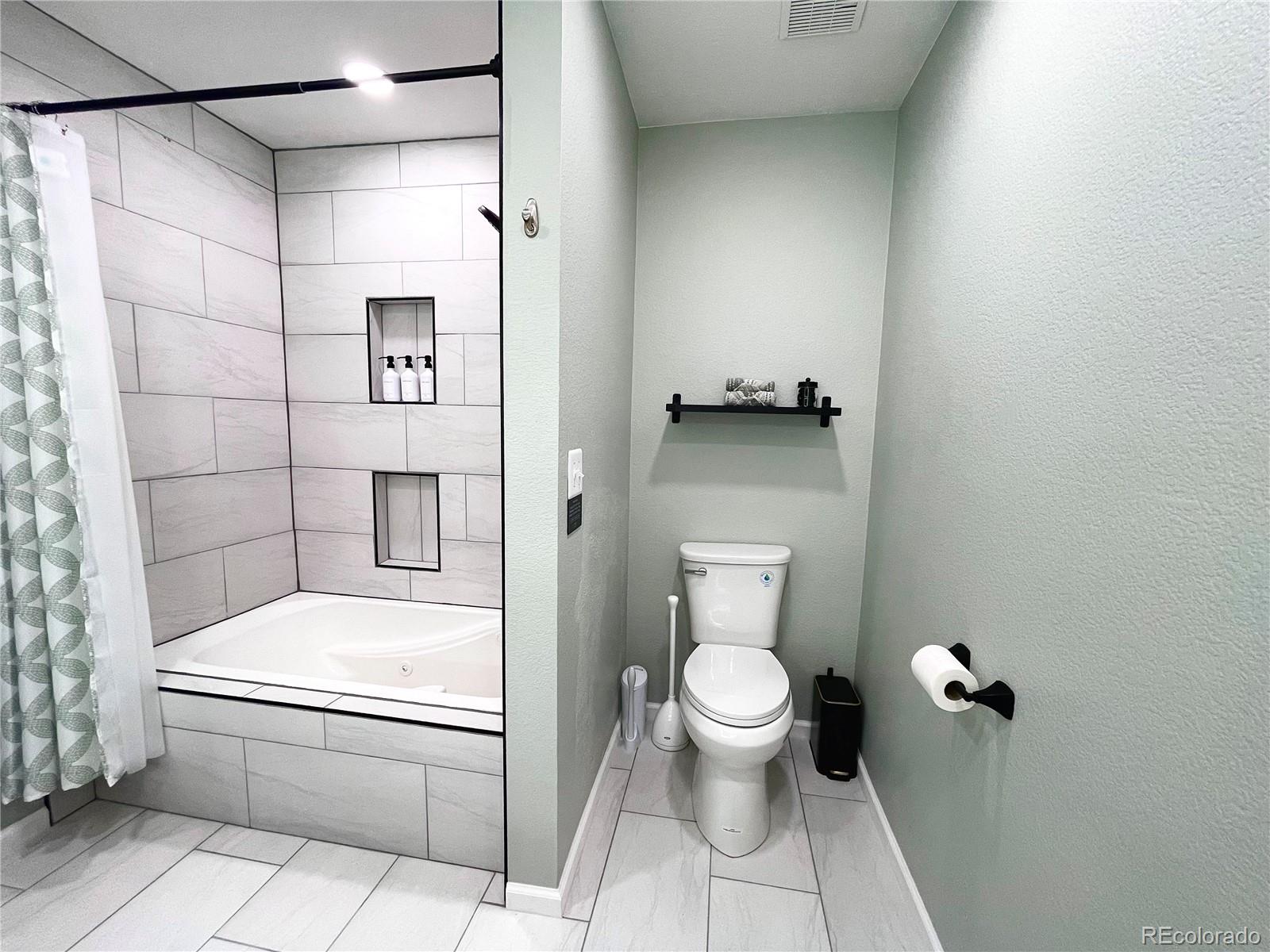 265 Caesar Road Black Hawk, CO 80422 - Photo 29 of 42 a bathroom with a toilet and a shower
