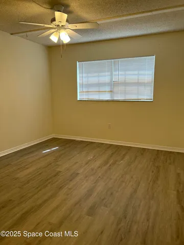 a bathroom with a sink mirror vanity and toilet