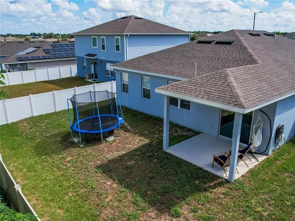an aerial view of a house having patio