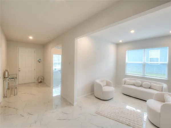 a living room with furniture and a window