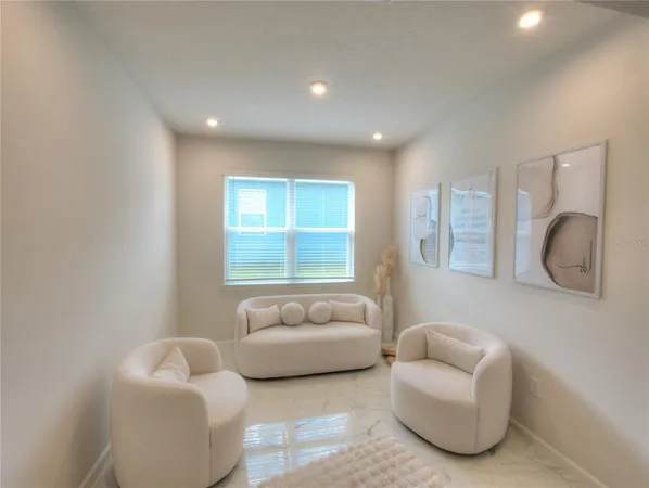 a living room with furniture and a window