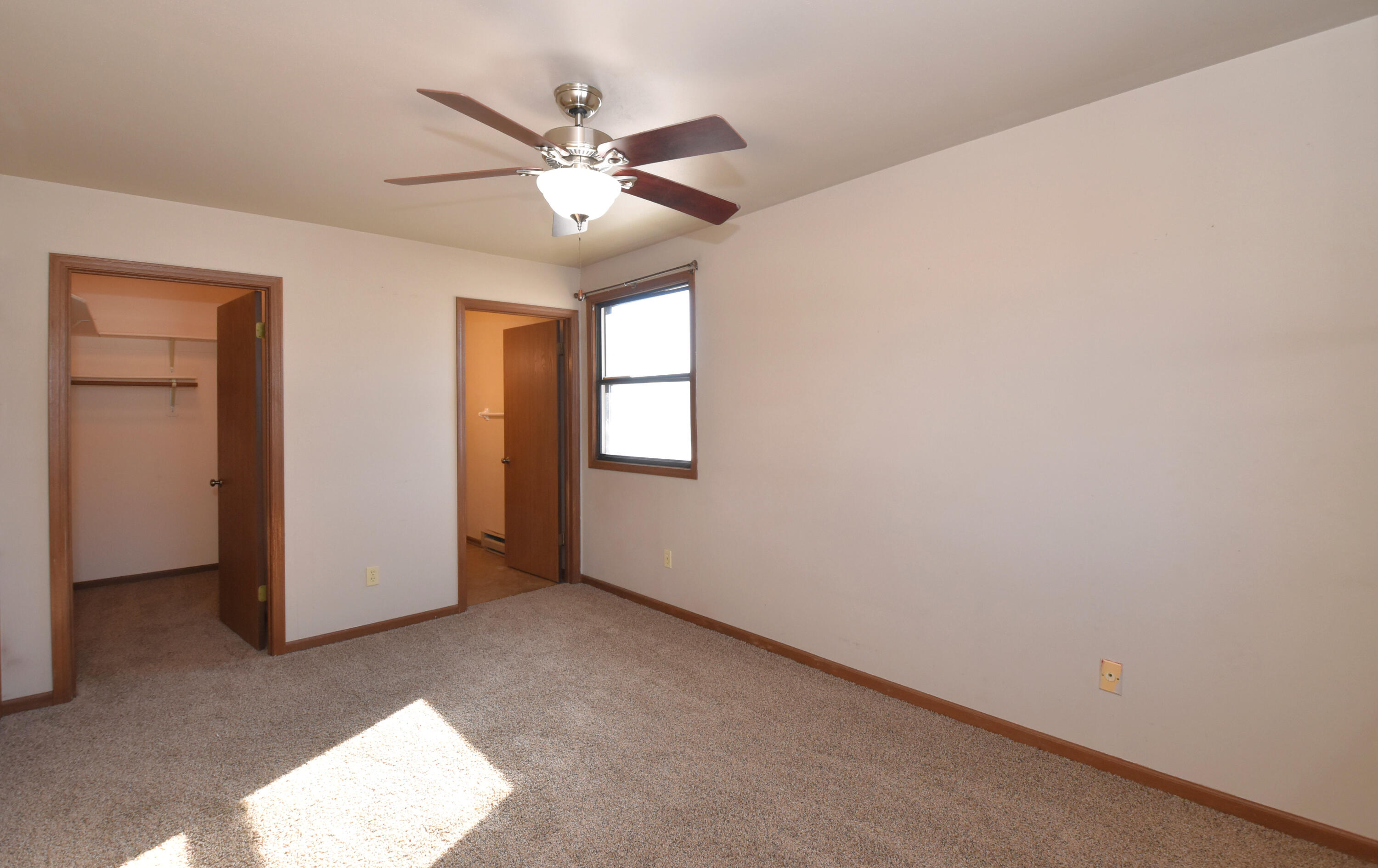 6840 Mariner Drive, Unit 103 Mount Pleasant, WI 53406 - Photo 16 of 33 Primary Bedroom