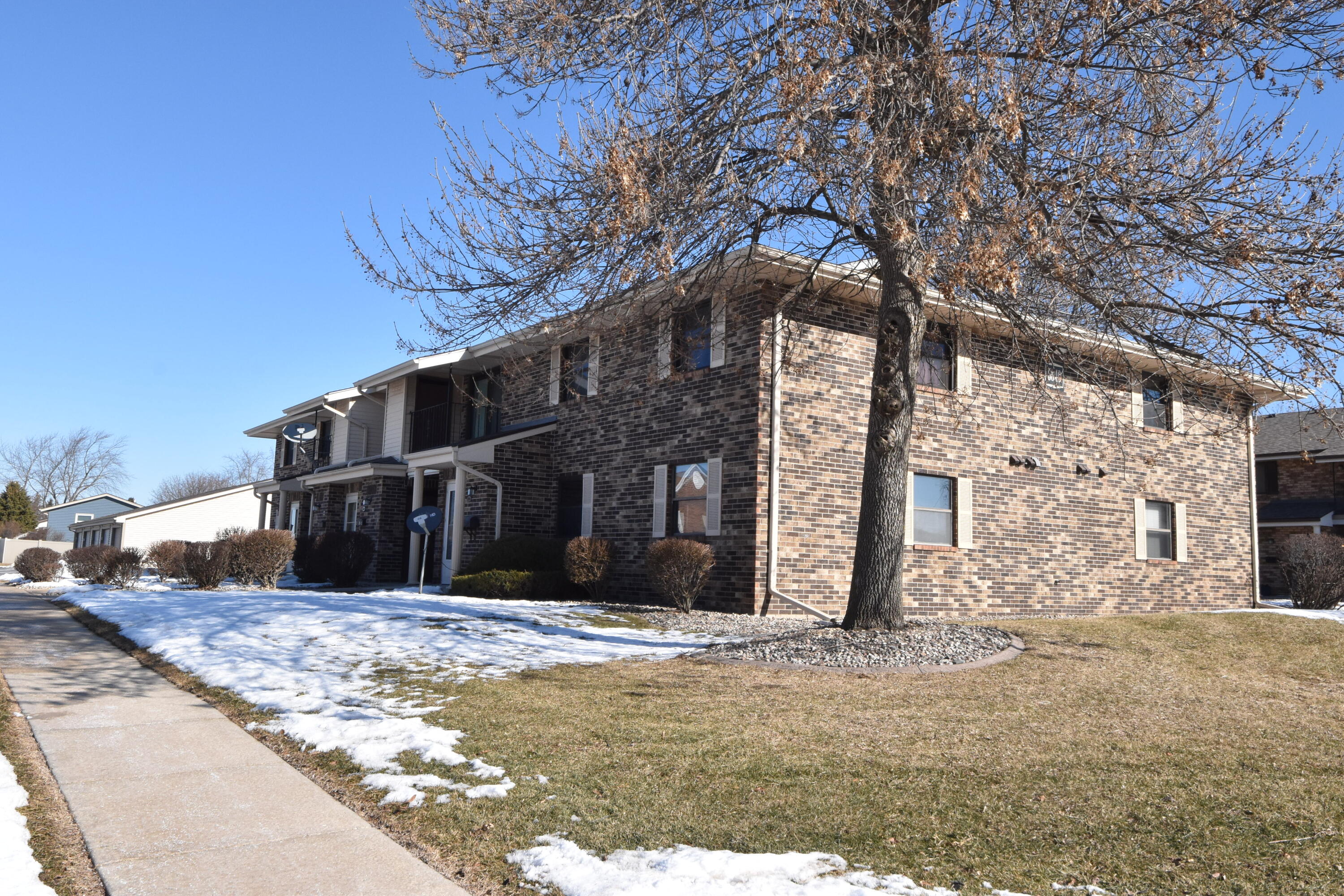6840 Mariner Drive, Unit 103 Mount Pleasant, WI 53406 - Photo 32 of 33 Side view
