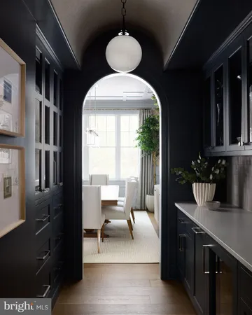 a kitchen with a refrigerator and a sink