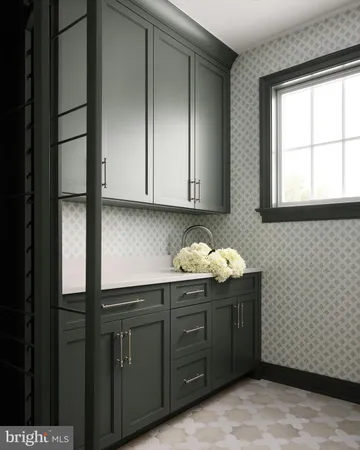 a kitchen with stainless steel appliances granite countertop white cabinets and window
