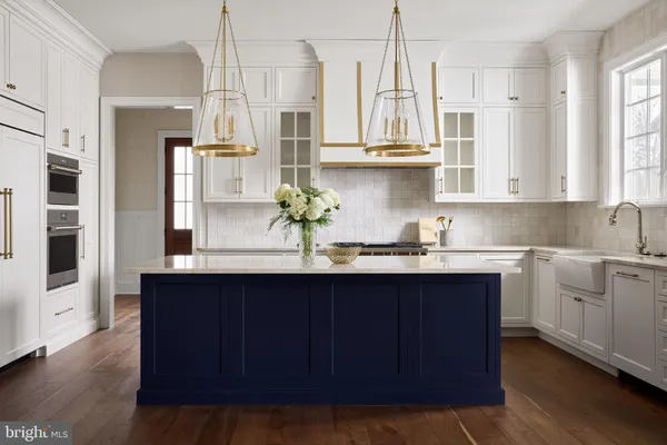 a kitchen with stainless steel appliances a sink stove and refrigerator
