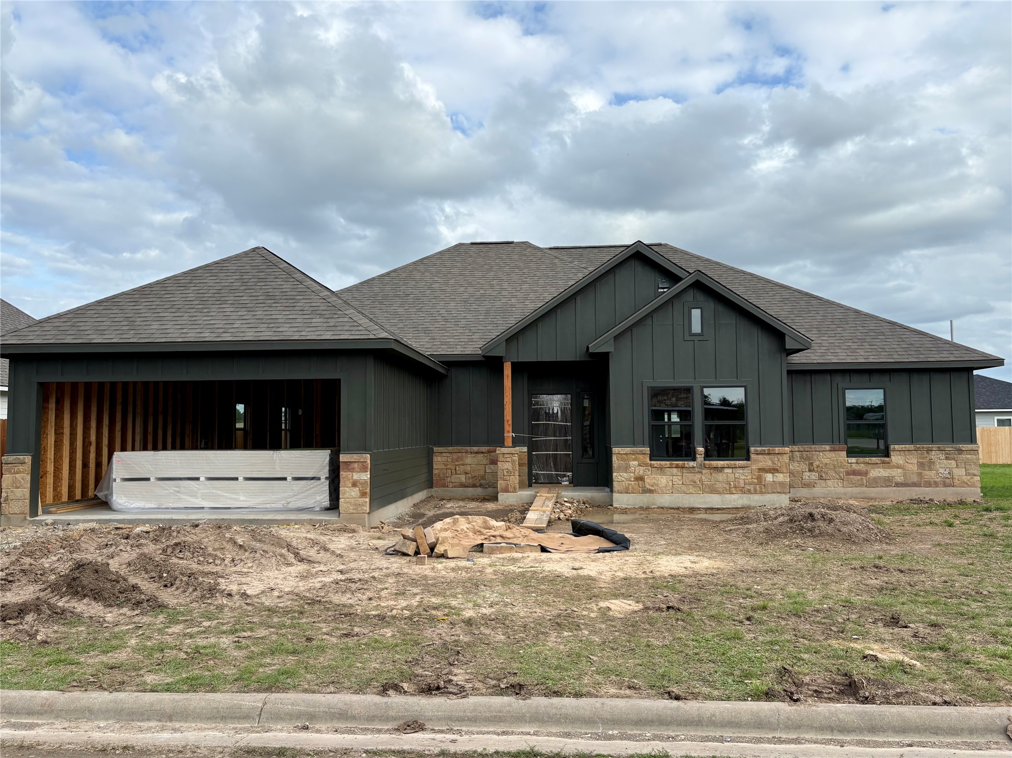 330 Cactus Street Giddings, TX 78942 - Photo 1 of 7 a front view of a house with a yard