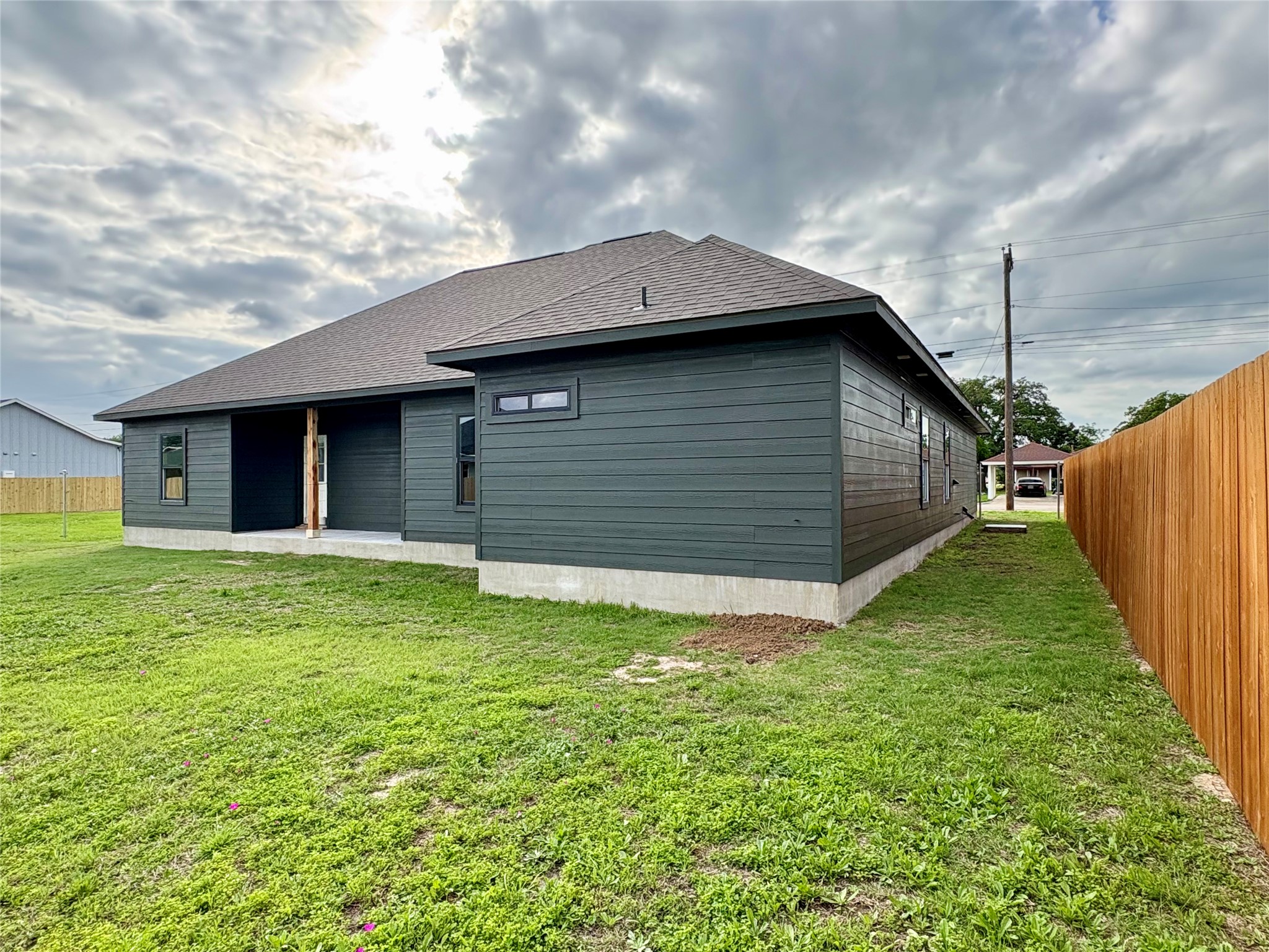 330 Cactus Street Giddings, TX 78942 - Photo 5 of 7 a backyard of a house with lots of green space