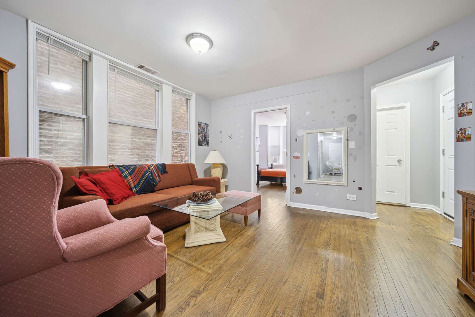 1453 South Springfield Avenue Chicago, IL 60623 - Photo 3 of 13 a living room with furniture and a large window