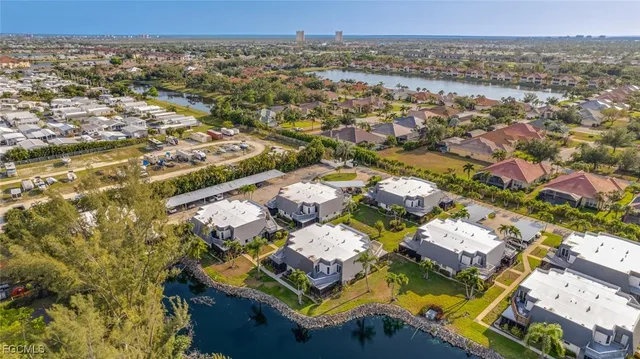 a view of a tennis ground with large trees