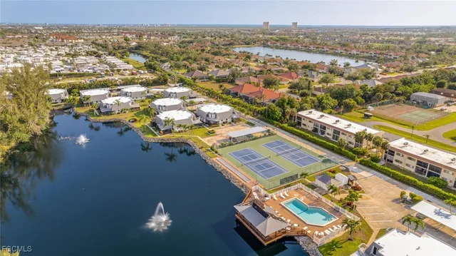 an outdoor view of house with swimming pool and seating