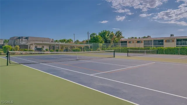 a view of a lake with a house in the background