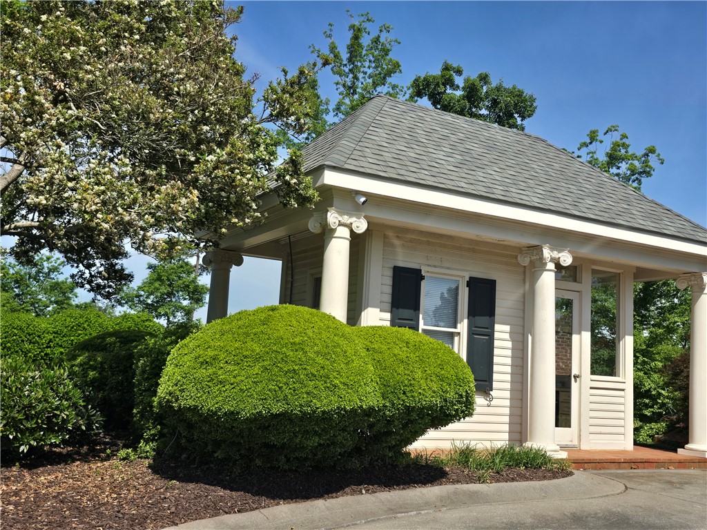 0 Turnberry Loop Seneca, SC 29678 - Photo 4 of 16 This charming gatehouse features classical columns and mature landscaping, offering a welcoming entry.