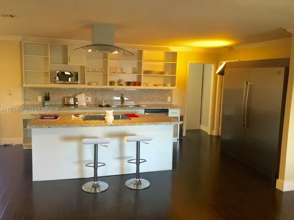 a view of a bathroom with a sink and mirror