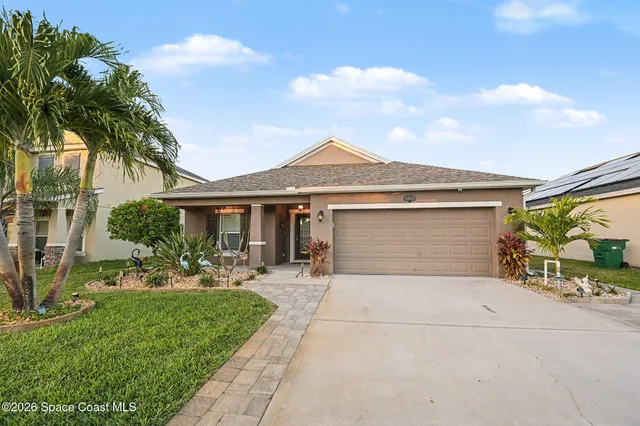 a front view of house with yard and outdoor seating