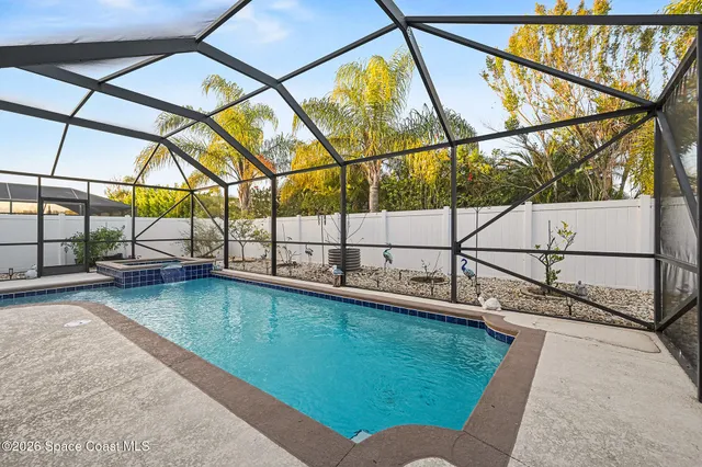a view of swimming pool with a back yard