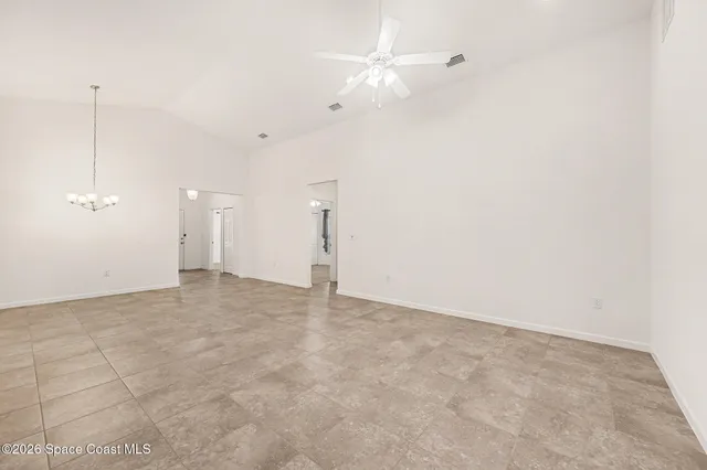 a view of an empty room with a fan